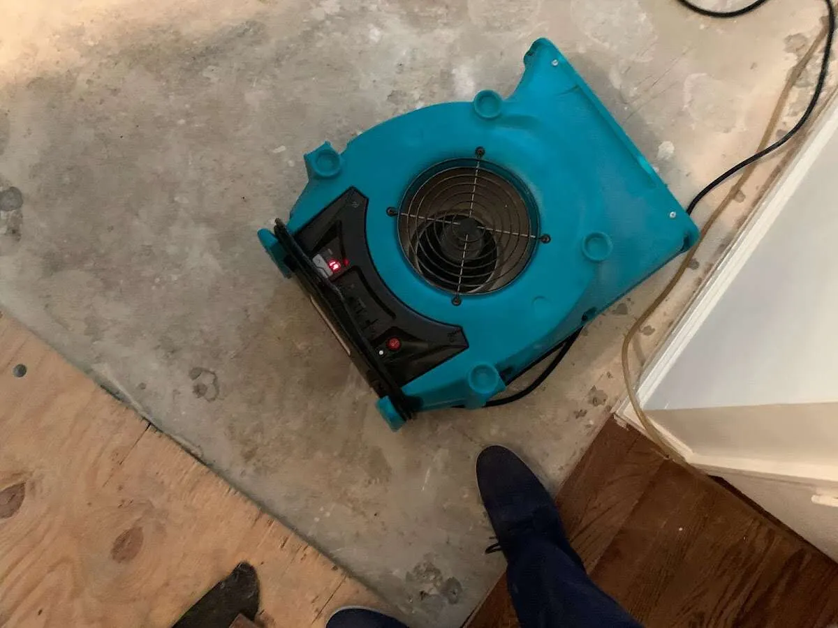 Air mover drying subfloor during Leak Detection & Repair in Greensburg